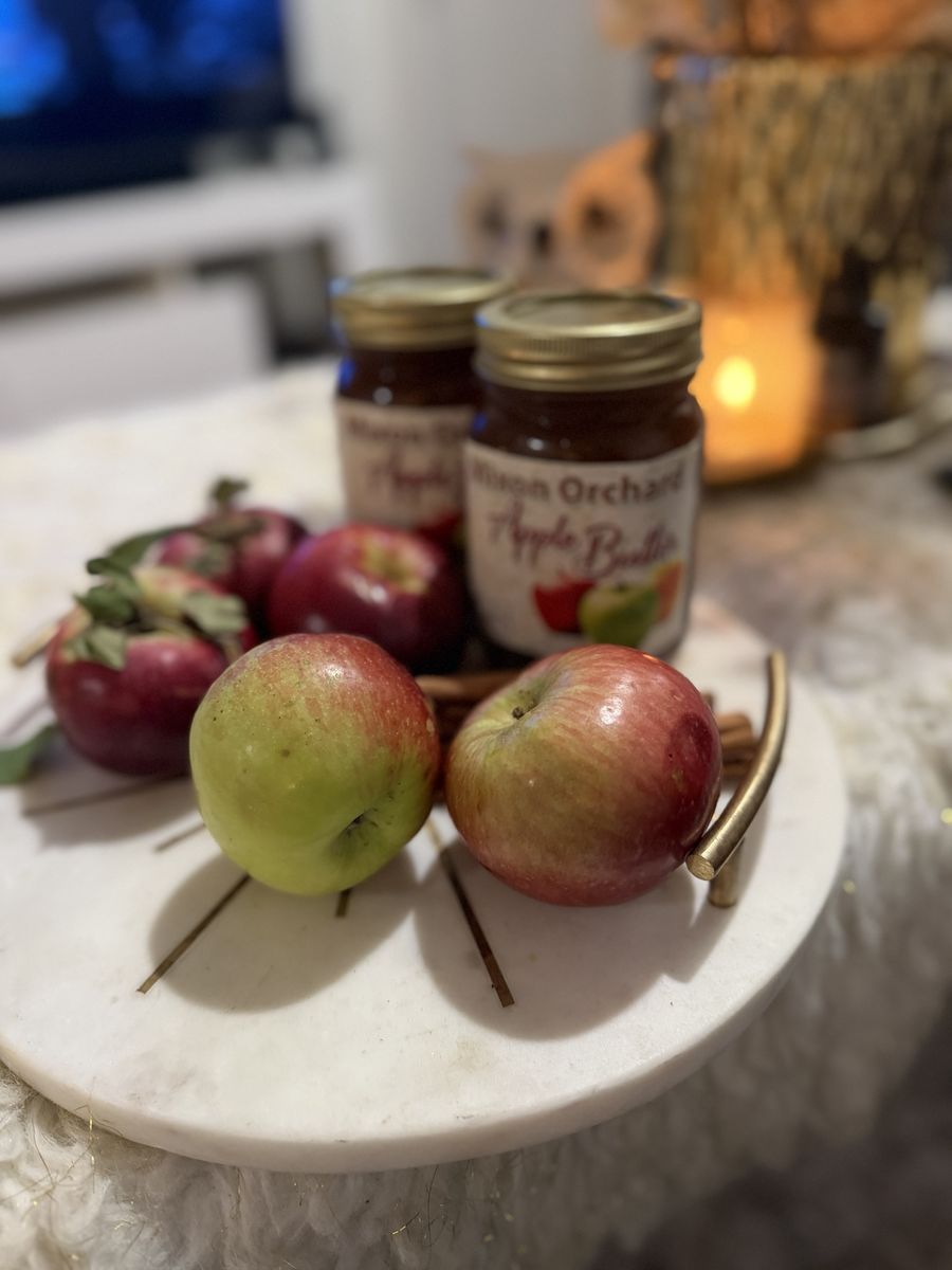 Jars of Mixon Orchard apple butter with apples